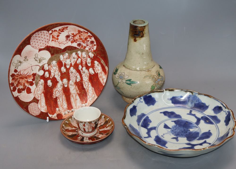 An 18th century Japanese blue and white dish, a studio vase and a Kutani plate and tea bowl and saucer, tallest 20cm
